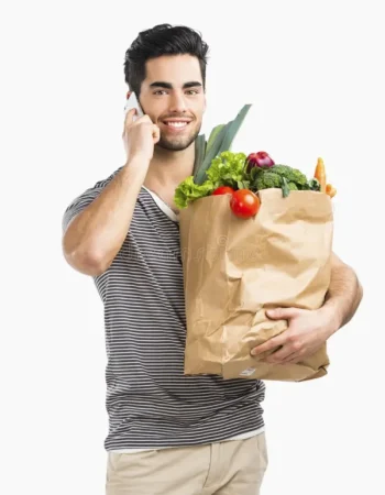 man-carrying-bag-full-vegetables-handsome-young-making-phone-call-isolated-over-gray-background-58604852